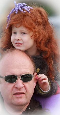 Riding on dad's shoulders